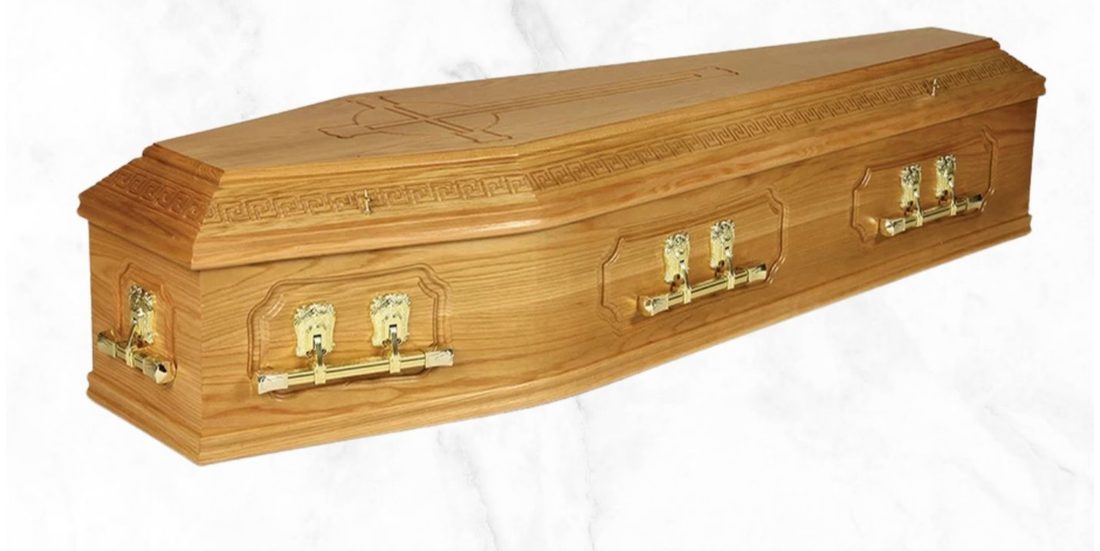 The Celtic Oak traditional solid oak coffin with carved lid design and brass handles