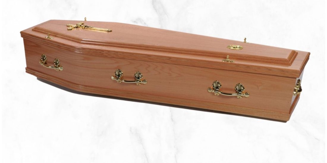 The Glenmore veneer coffin with raised lid and white pattern interior